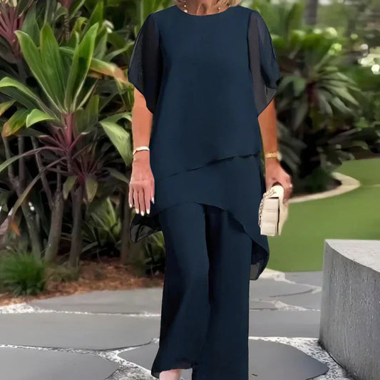 ✨️Nouveaux arrivages✨️Deux-pièces pour femmes : Charmant top asymétrique & pantalon à jambes larges(🔥51 % de réduction)
